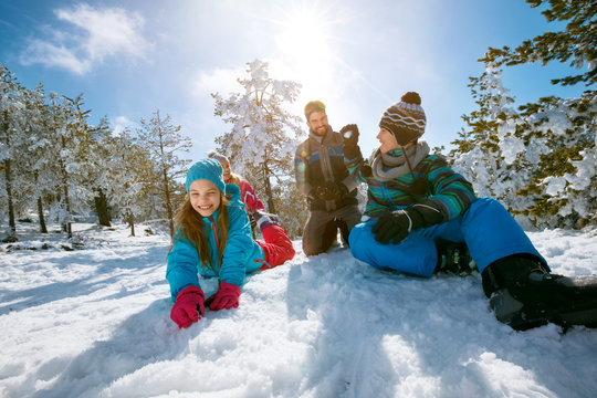 Ski, snow sun and fun - family enjoying winter vacations