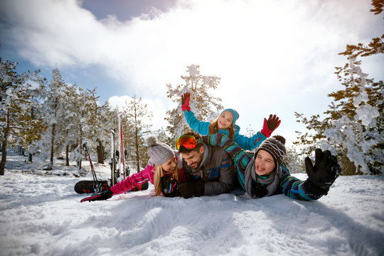 family on winter vacation - Ski, snow, sun and fun