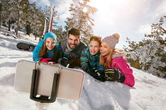 smiling family having fun - Mobile photo. Selfie