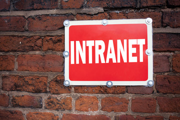 Obraz premium Hand writing text caption inspiration showing Intranet word cloud concept meaning Internet Network Technology written on old announcement road sign with background and copy space