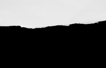torn or ripped of paper in black background