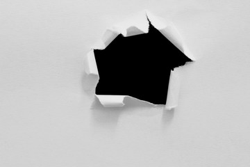 torn or ripped of paper in black background