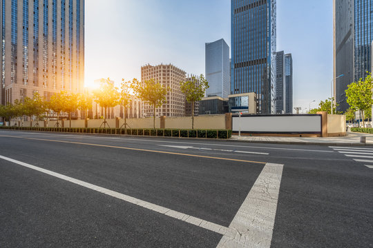 Empty Road And Modern Office Block Buildings Against Sky, China.