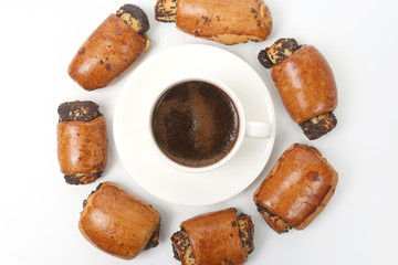 rolls with poppy seeds and white Cup of black coffee