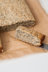 Homemade lemon poppy seed sheet cake baked in enamel baking dish on white background