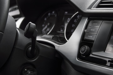 car interior, phone buttons, janitor control Volume control and mobile phone control on the front panel. Ventilation holes, odometer and interior trim.