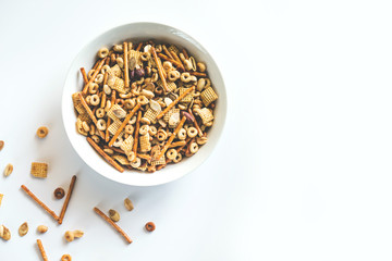 Snack mix with chex, pretzels, nuts, and pumpkin seeds