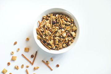 Snack mix with chex, pretzels, nuts, and pumpkin seeds
