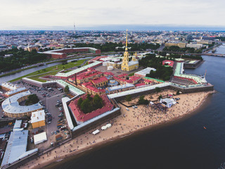 Beautiful aerial morning view of Saint-Petersburg, Russia, The Vasilievskiy Island at sunrise, Isaacs Cathedral, Admiralty, Palace Bridge, cityscape and scenery beyond the city, shot from drone