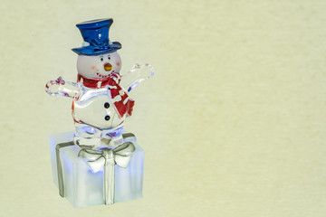 New Year`s glass transparent snowman with gift on white background for greeting card design
