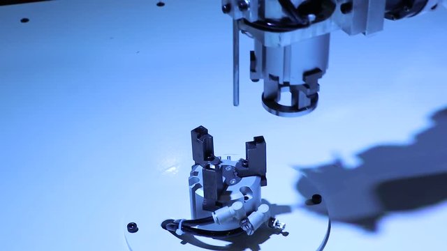 Robot pick parts in factory ; industrial manufacturing equipment background