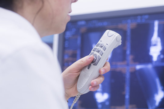 Radiologist recording results.