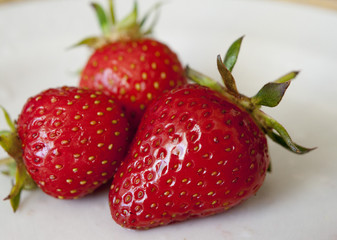 ripe strawberry on a plate