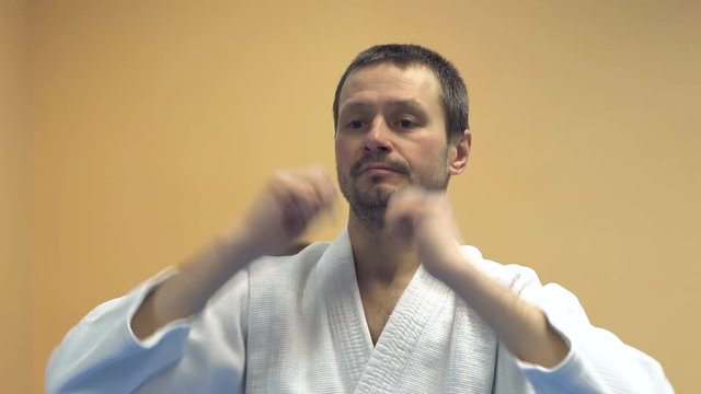 Preparation for training in martial arts. Warm up in the gym. Sport. Aikido. Karate.