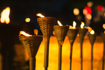 bamboo fire torch Neutral flame outdoor work for lighting in the evening and night color light bokeh background