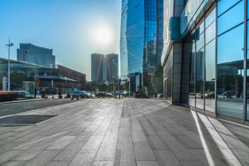 Fototapeta na wymiar modern buildings and empty pavement in china..