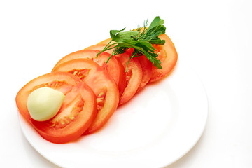 tomatoes in a bowl with garlic and parsley