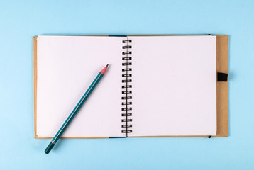 Open notebook and pencil with space for text