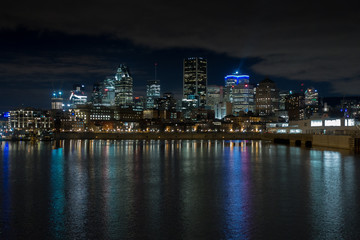 Fototapeta na wymiar Montreal Downtown Skyline Night River Reflection
