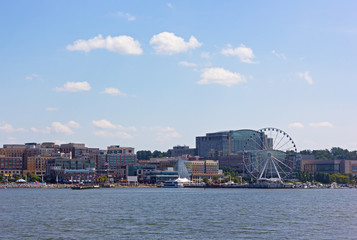 National Harbor waterfront panorama in Oxon Hill, Maryland, USA. Panorama of National Harbor with Ferris and modern buildings.