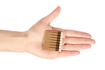 Match sticks with white heads in a row in hand isolated on white background