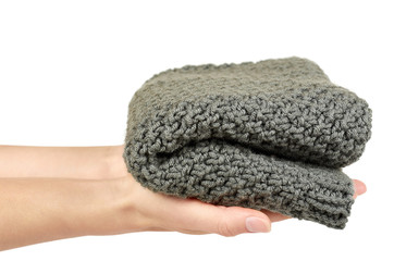 Warm winter clothes in hand isolated on white background. Sale and buy