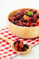 Black mulberry fruit in bowl