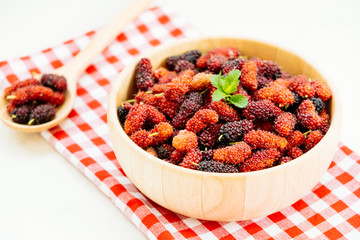 Black mulberry fruit in bowl