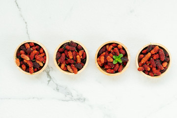 Black mulberry fruit in bowl