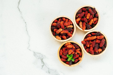 Black mulberry fruit in bowl