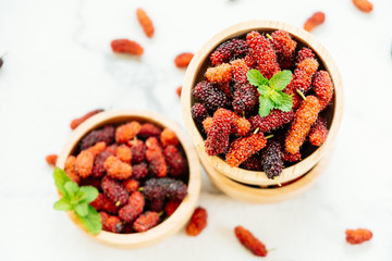 Black mulberry fruit in bowl