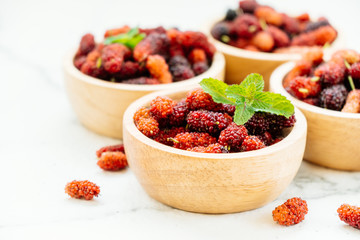 Black mulberry fruit in bowl