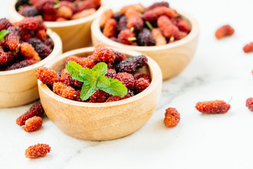 Black mulberry fruit in bowl