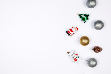 Fototapeta na wymiar Christmas holiday background. Santa claus, Reindeer, Snowman and decorative christmas ornaments on a white background with copy-space. Top view.