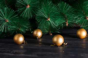 golden christmas balls on spruce branches