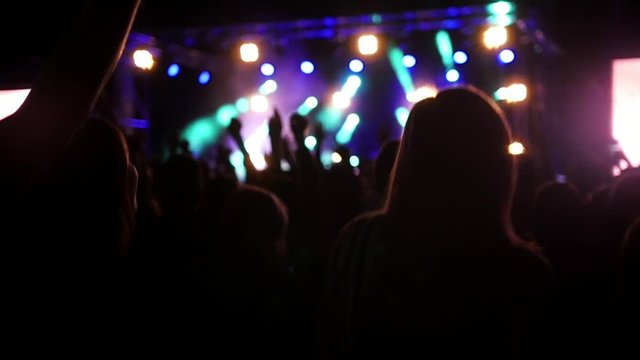 Young people dancing at the rep rock concert, slow-motion