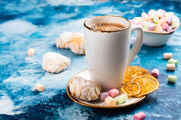 Hot chocolate with marshmallows and cookies on Christmas background