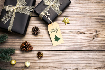 Christmas background - Christmas present gifts box and rustic decoration on vintage wooden background. Creative Flat layout and top view composition with border and copy space design.