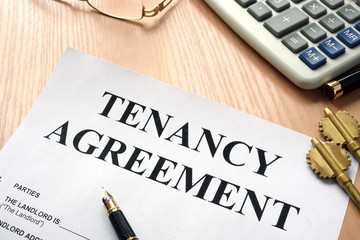 Tenancy agreement and keys from home in a real estate agency.