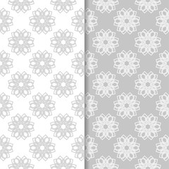 Floral seamless patterns. Set of light gray vertical wallpaper backgrounds