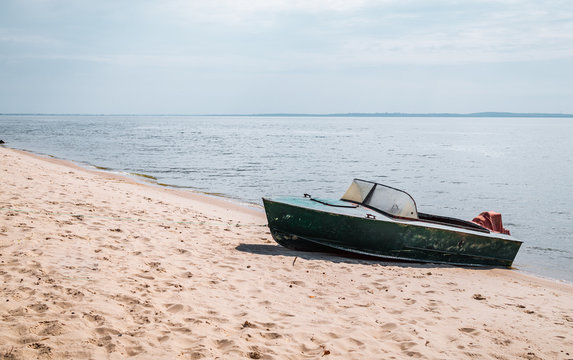 Old fishing boat on a sandy beach