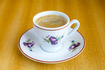 Coffee cup on a wooden table