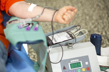 Blood donation hand. Blood bag