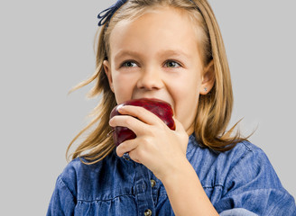 Cute girl holding an apple