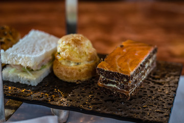 three tier afternoon tea set and pastries