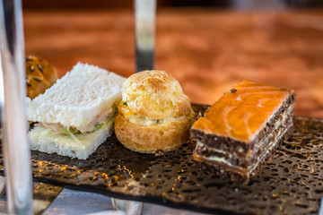 three tier afternoon tea set and pastries