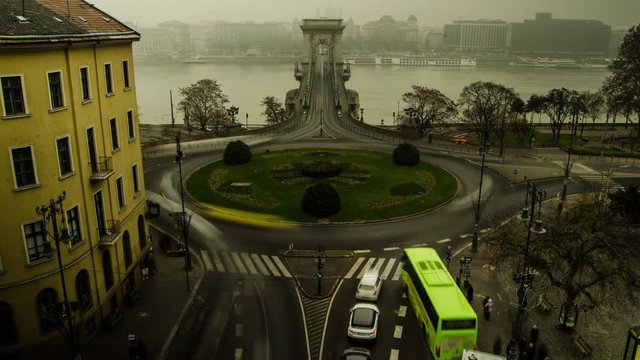 BUDAPEST &ndash; Timelapse of Clark Adam square roundabout traffic on a foggy winter day  with Chain Brudge in view