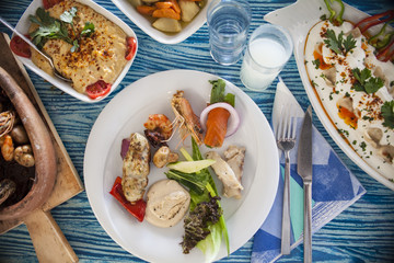 traditional mediterranean fish table and salad