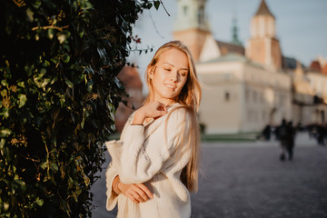 Young stylish woman in a city street on sunlight