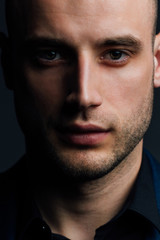 Obraz premium Close-up portrait of a attractive handsome man. Good nice guy looks at the frame.